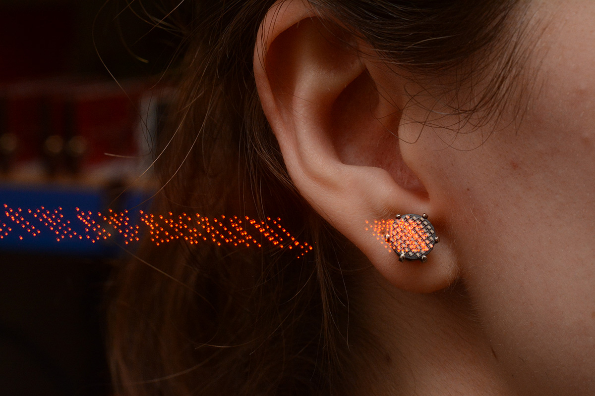 Long exposure LED trails of the earring being worn