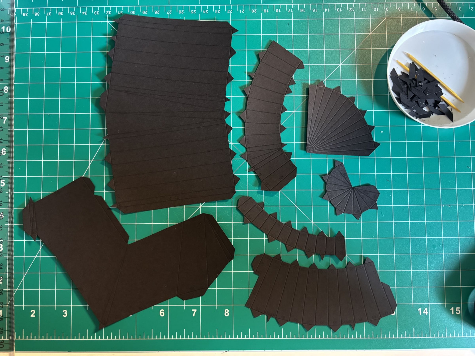 All the parts to make one of the engine/wings, cut and scored.