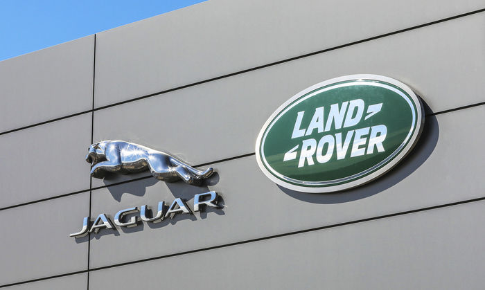 The exterior of a building holds Jaguar and LandRover sign