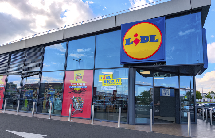 The facade of a LIDL food supermarket on a sunny day.