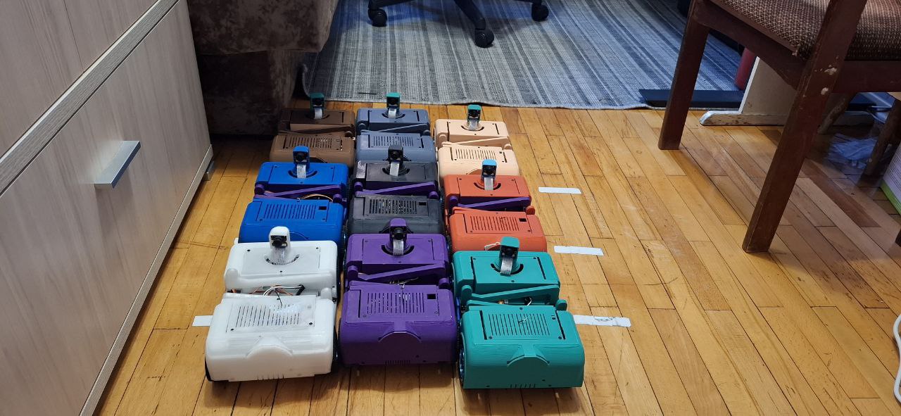 Можно увидеть на полу белые наклейки, это тестовые RFID метки навигации