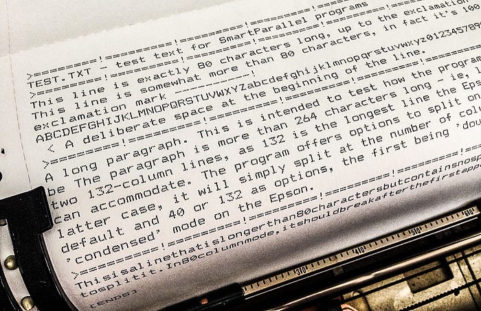 Close-up photograph of test text printed on a dot matrix printer.