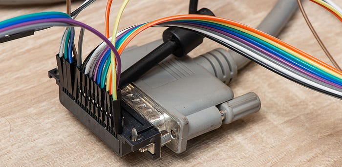 Close-up photograph of a printer cable with lots of small wires connected to it.