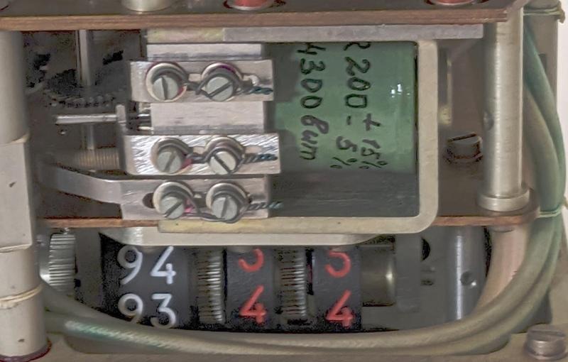 One of the driving solenoids in the Globus. The wheels to indicate orbital time are underneath.