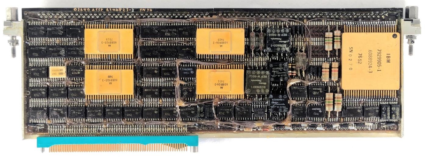 The network interface page, called the MIA (Multiplex Interface Adapter). The page has extensive rework; thin brown "bodge" wires snake around the page to repair errors or implement updates.